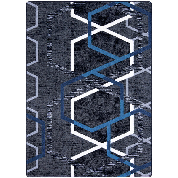 A Joy Carpets rectangle area rug with blue and grey hexagons on it.