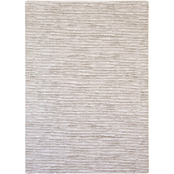 A white area rug with a beige and light gray pattern.