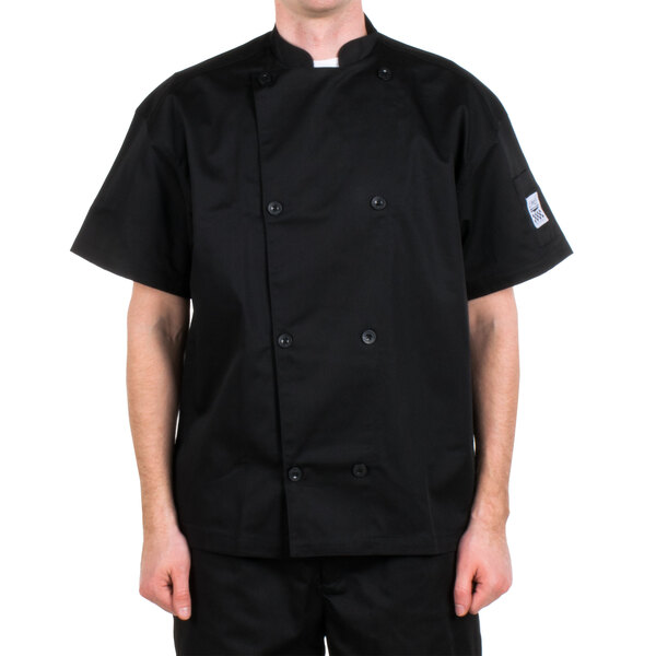 A man wearing a black Chef Revival chef coat.