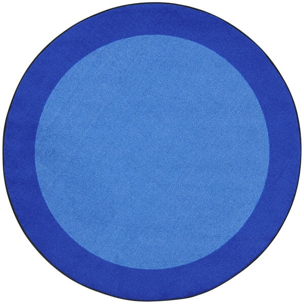 A blue circle rug with a white border.