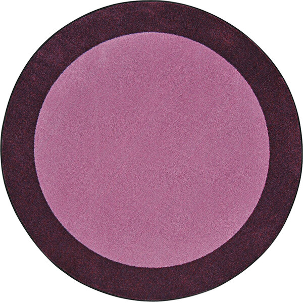 A purple circle rug with a black border and brown and black design.