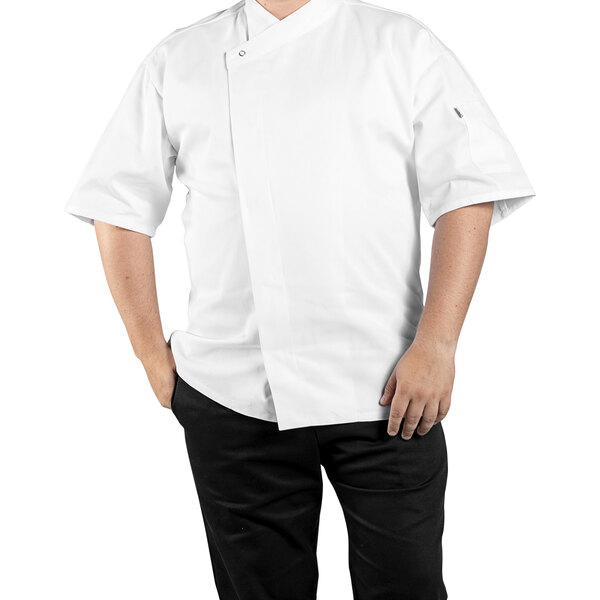 A man wearing a Uncommon Chef white short sleeve chef coat with a mesh back.
