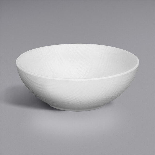 A white Cal-Mil melamine bowl with a curved design.