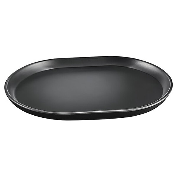 A black oval shaped melamine platter with a raised rim.