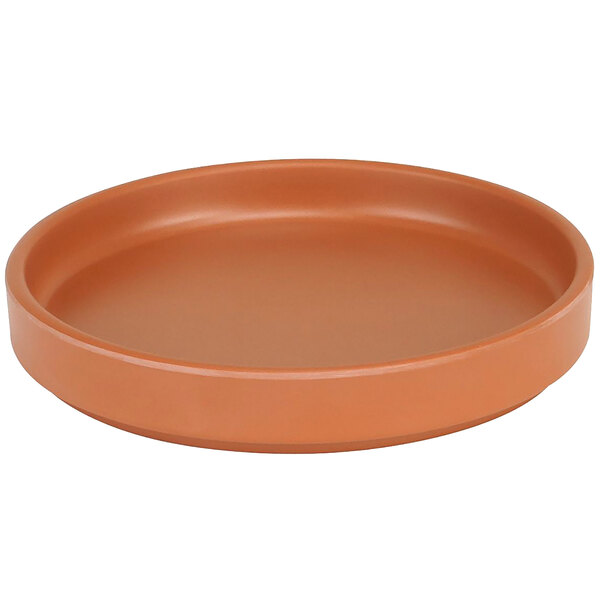 A brown Cal-Mil melamine plate with a low rim.