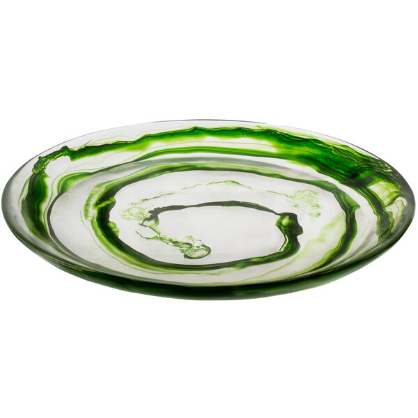 A white round platter with green swirls.