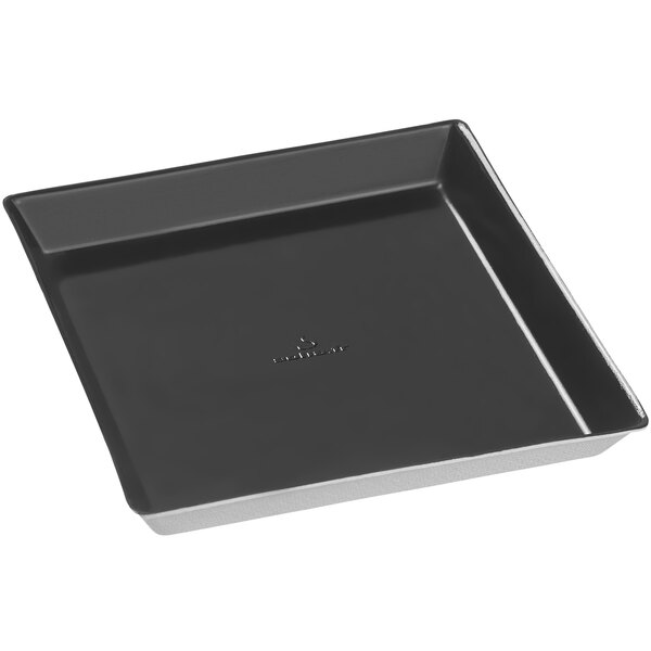 A Solia black square plate with a white border.