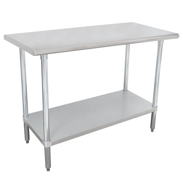 A white rectangular Advance Tabco stainless steel work table with an undershelf.