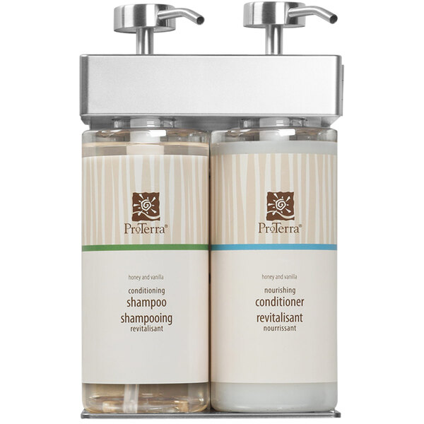 A white wall-mounted dispenser with two oval bottles of ProTerra shampoo and conditioner inside.