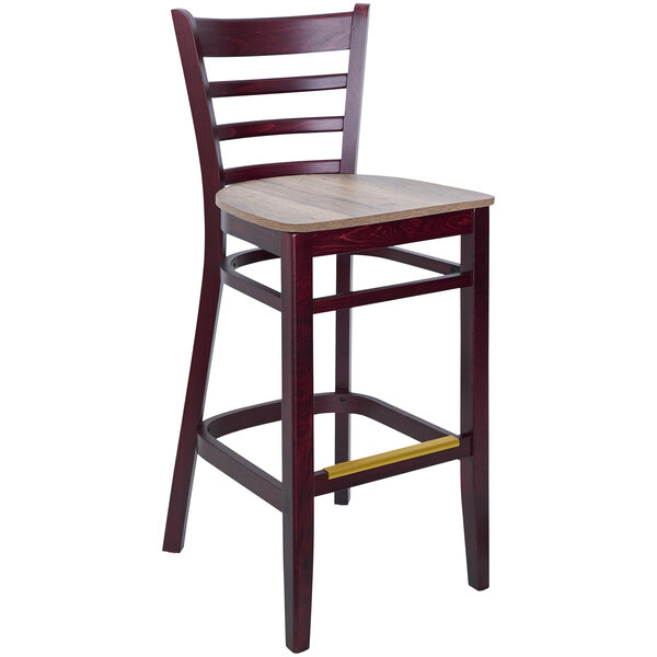 A BFM Seating Berkeley Dark Mahogany beechwood barstool with a wooden seat and ladder back.