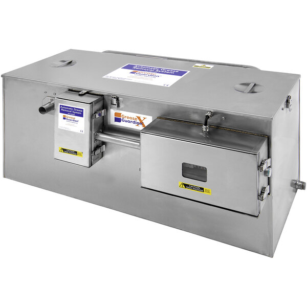 A stainless steel Grease Guardian GGX75-IS automatic grease trap on a counter.
