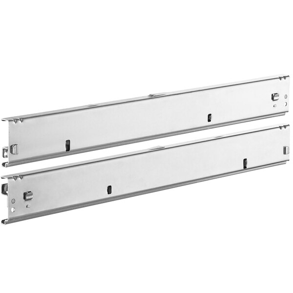A pair of metal brackets with two holes on each side.