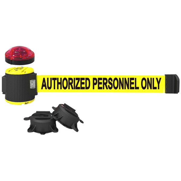 A yellow Banner Stakes wall mount belt barrier with black and red components.