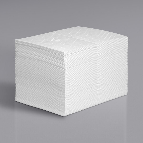 A stack of white New Pig oil absorbent mat pads.