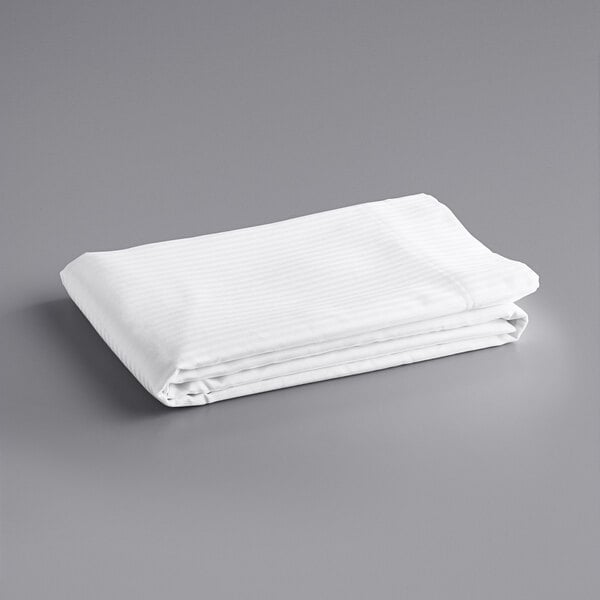 A folded white Oxford Superblend tone on tone stripe bed sheet.
