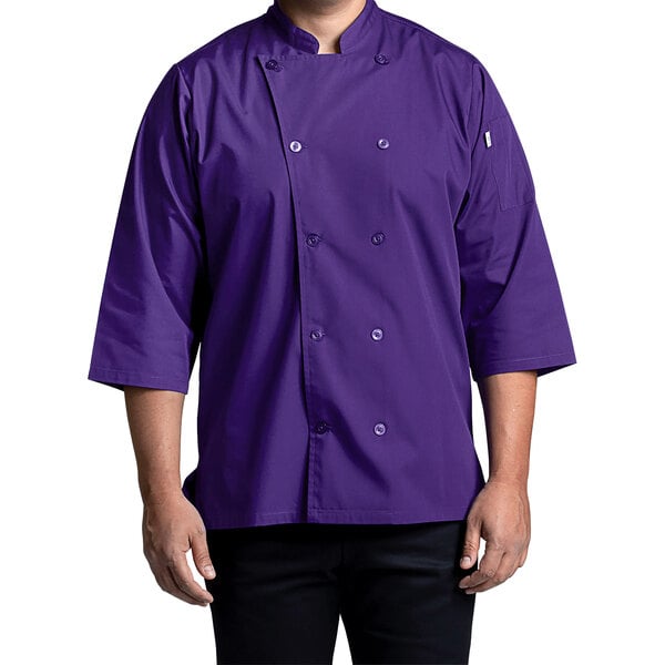 A man wearing a grape Uncommon Chef 3/4 sleeve chef coat.
