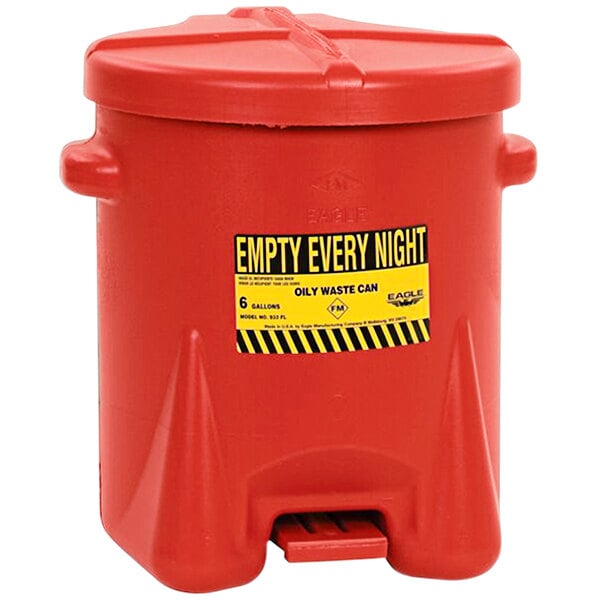 A close-up of a red Eagle Manufacturing oily waste can with a yellow and black label.