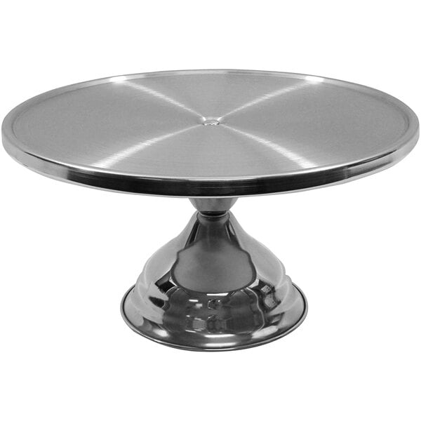 A Tablecraft stainless steel cake stand with a round surface.