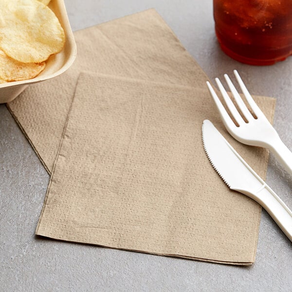 A fork and knife next to an EcoChoice natural kraft luncheon napkin.