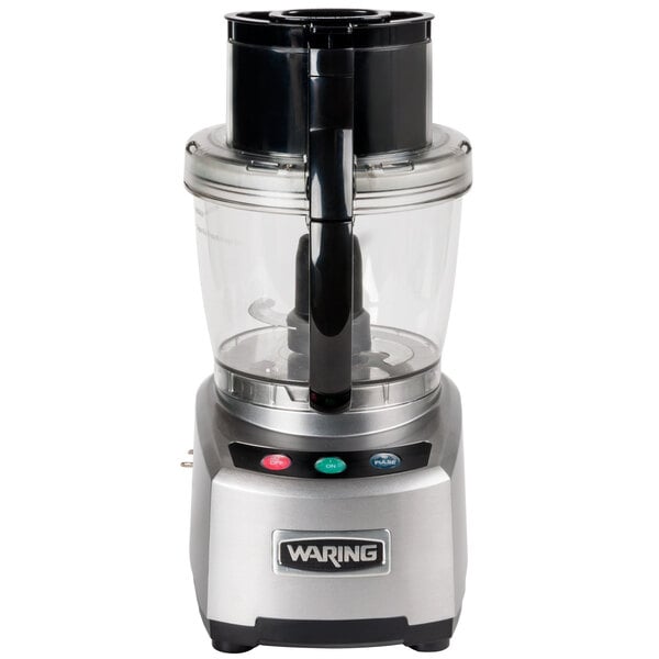 A Waring commercial food processor with a clear bowl and black base.