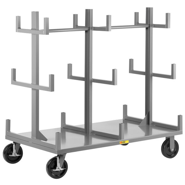 A white metal Little Giant bar and pipe cart with 18 cradles on wheels.