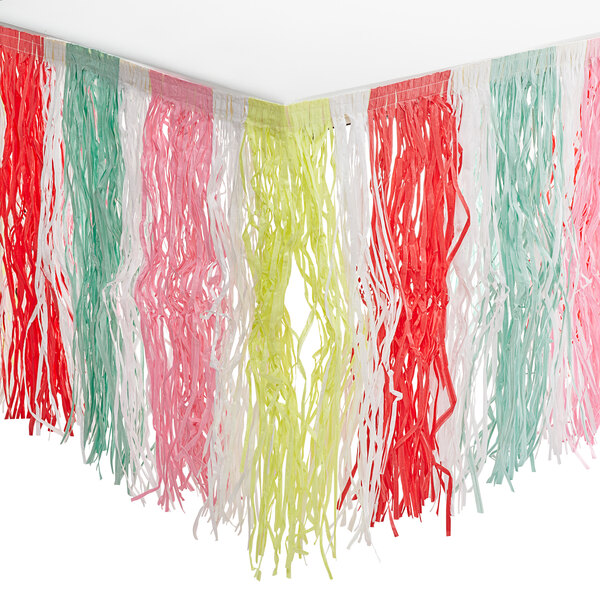 A Just Chillin' grass table skirt with a colorful tassel fringe hanging from a ceiling.