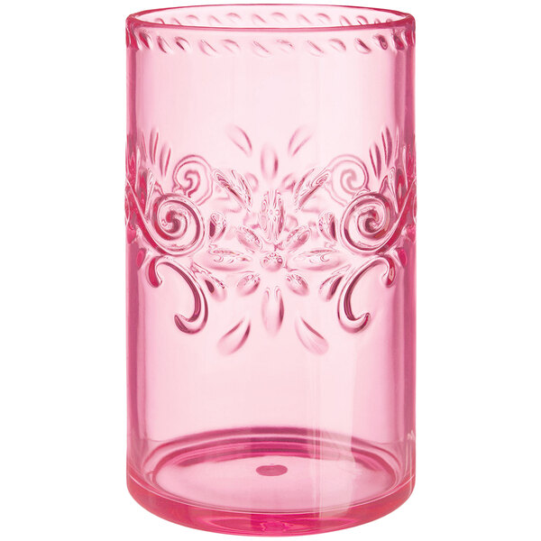 A pink Amscan plastic highball tumbler with a floral design.