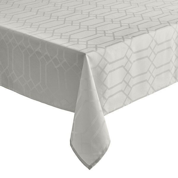 A cream rectangular tablecloth with a gate pattern on it.