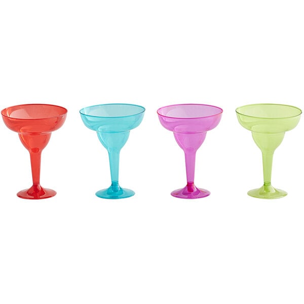 A row of colorful Amscan plastic margarita glasses with stems.