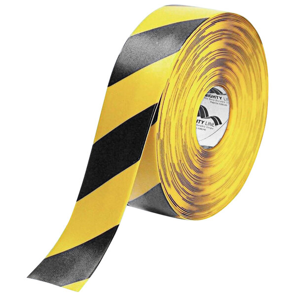 A roll of yellow and black tape with chevron patterns and a warning sign with Mighty Line label.
