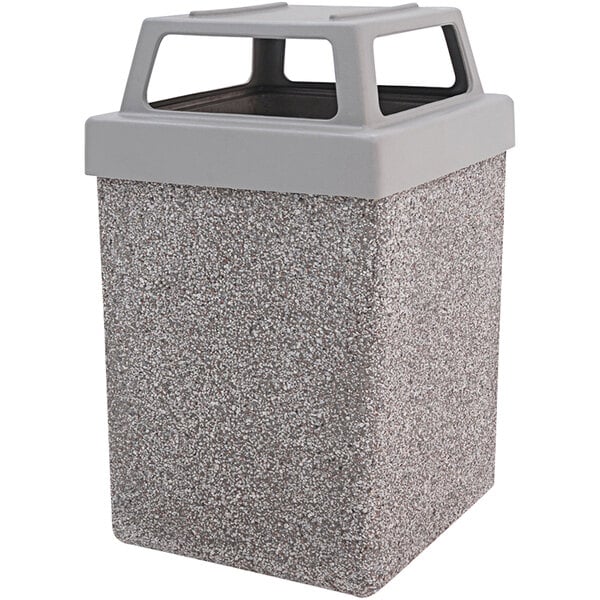 A grey Wausau Tile square concrete trash receptacle with a black plastic lid.