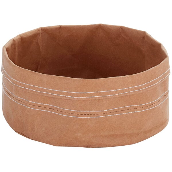 A brown paper basket with white stitching.