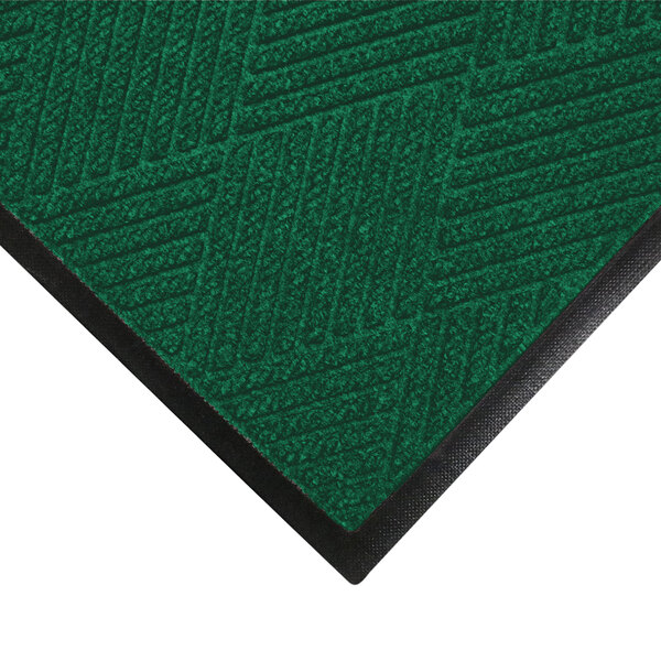 A green WaterHog Eco Premier doormat with black trim.