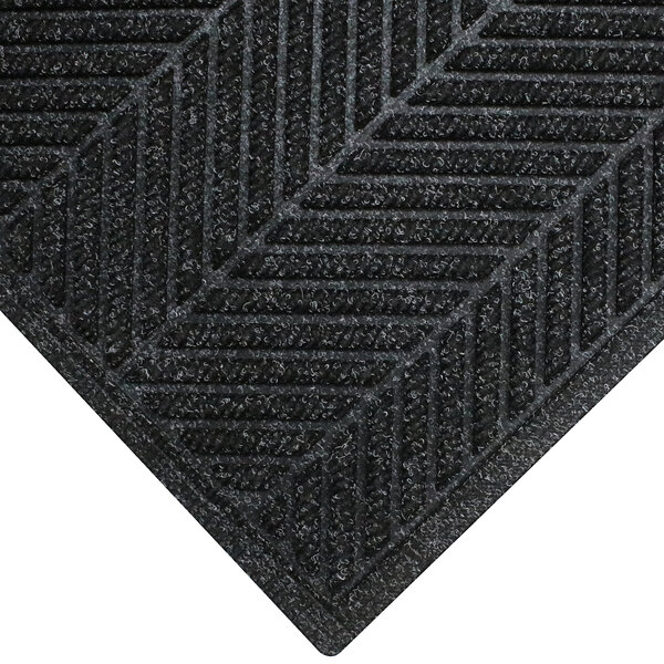 A black M+A Matting WaterHog Eco Elite doormat with a chevron patterned border.