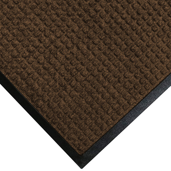 A dark brown WaterHog mat with black rubber border.