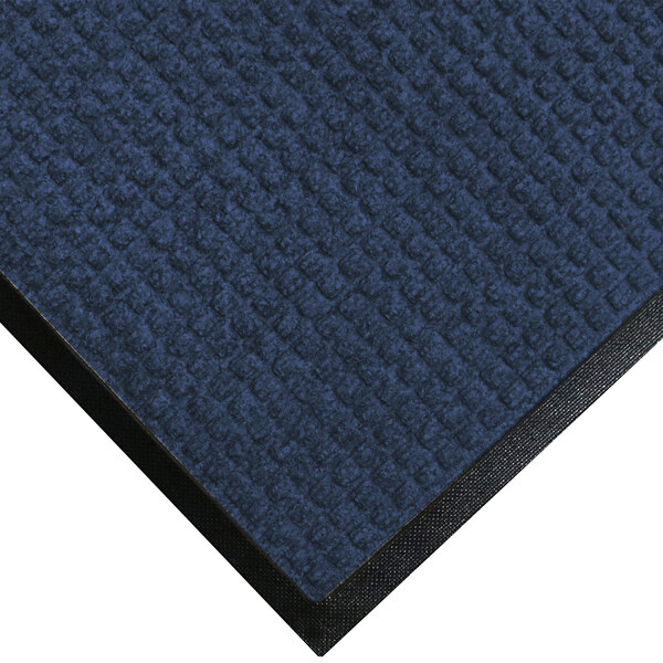 A navy blue WaterHog mat with a black rubber border.
