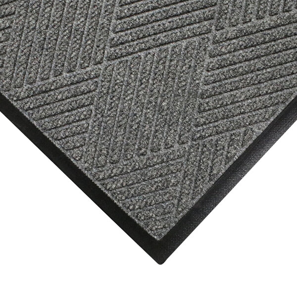A close-up of a grey WaterHog Eco Premier carpet mat with a black border.