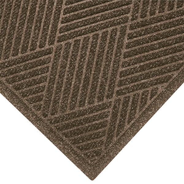 A brown M+A Matting WaterHog Eco Premier mat with a patterned border.