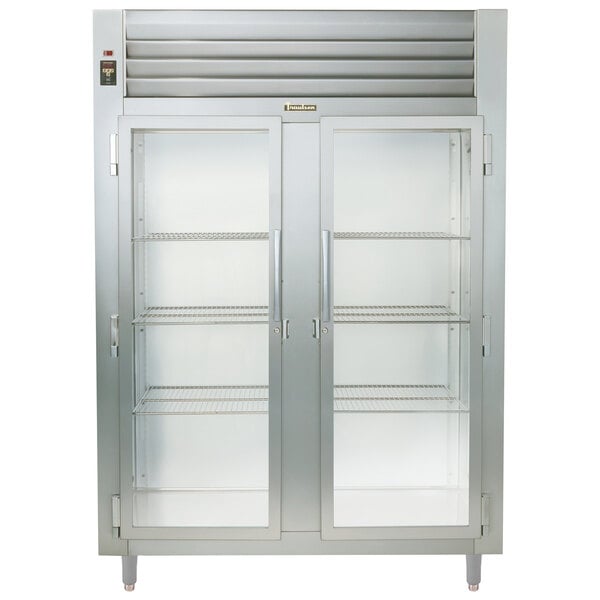 A Traulsen stainless steel two section glass door reach-in refrigerator.