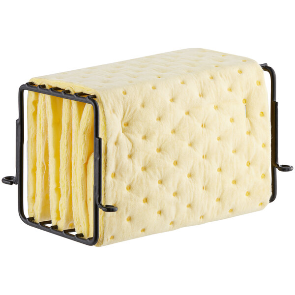A metal rack holding yellow sponge.