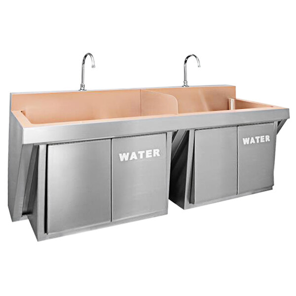 A stainless steel Just Manufacturing wall-hung double bowl scrub sink with knee operated faucets over two stainless steel sinks.