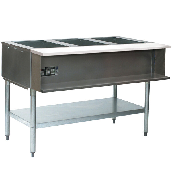 An Eagle Group stainless steel natural gas water bath steam table with three pans on a counter.