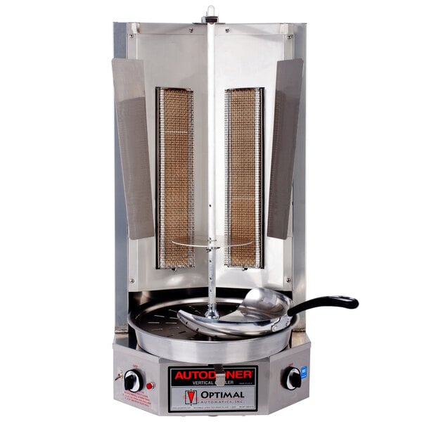 An Optimal Automatics Autodoner vertical broiler with a pan on top.