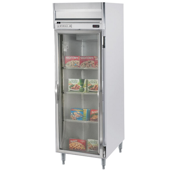 A Beverage-Air stainless steel reach-in freezer with glass doors and shelves.