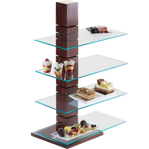 A display of desserts on a Cal-Mil Westport single pillar stand with three tiers.