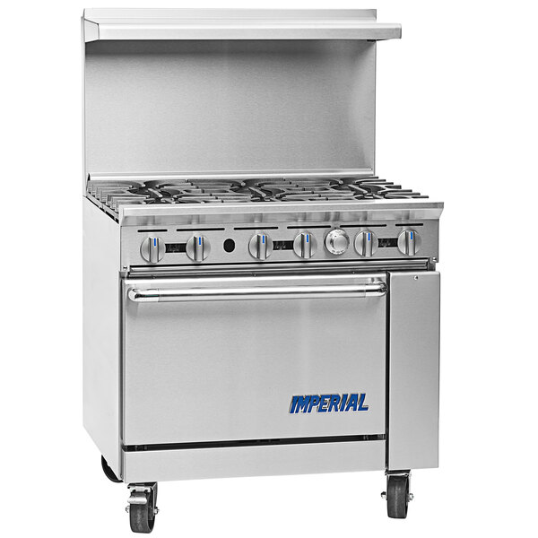 An Imperial Range stainless steel commercial gas range with 2 burners and a griddle over a cabinet.
