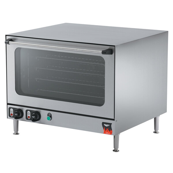 A Vollrath countertop convection oven with a glass door and a rack.