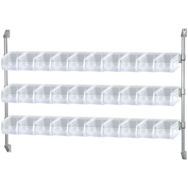 A Quantum white wall mount cantilever shelf with clear plastic bins.