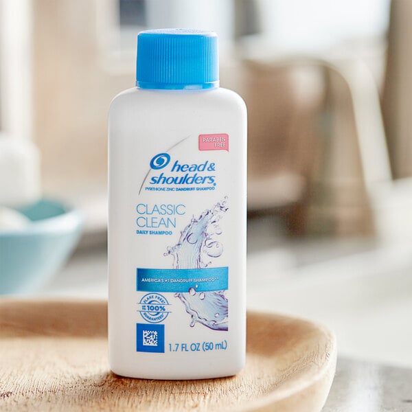 A white bottle of Head & Shoulders Classic Clean shampoo with blue text.