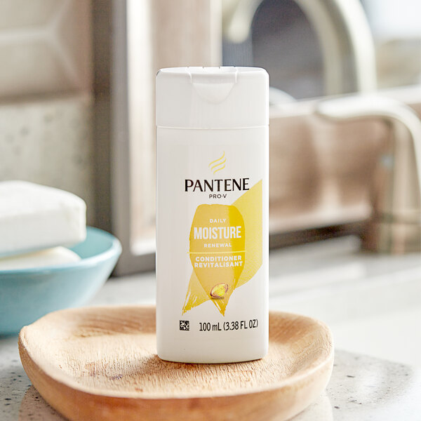 A close-up of a bottle of Pantene Pro-V Daily Moisture Renewal Conditioner.